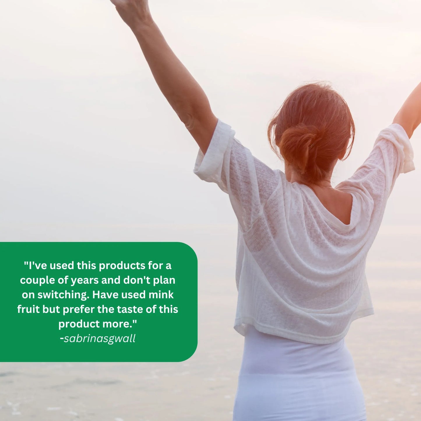 A woman stands with arms raised overlooking the sunrise. A text bubble contains a user's positive product review.