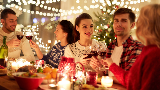 A festive holiday table with healthy dishes, including roasted vegetables, a fresh green salad, and fruit-infused water, symbolizing balanced and mindful holiday eating.